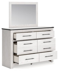 Schoenberg Queen Panel Bed with Mirrored Dresser - furniture place usa