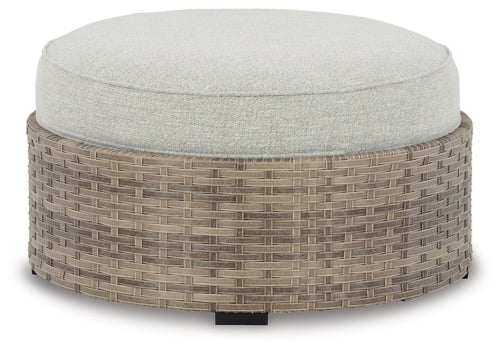 Calworth Outdoor 9-Piece Sectional with Ottoman - furniture place usa