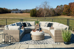 Calworth Outdoor 9-Piece Sectional with Ottoman - furniture place usa