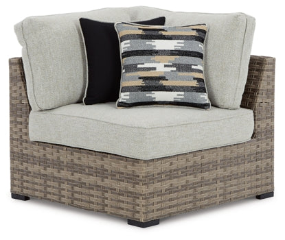 Calworth Outdoor 9-Piece Sectional with Ottoman - furniture place usa