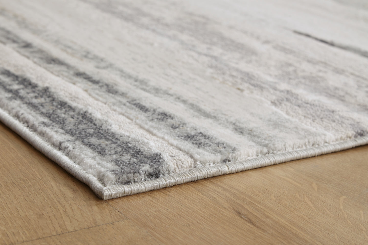 Abanett 5'3" x 7'3" Rug - furniture place usa