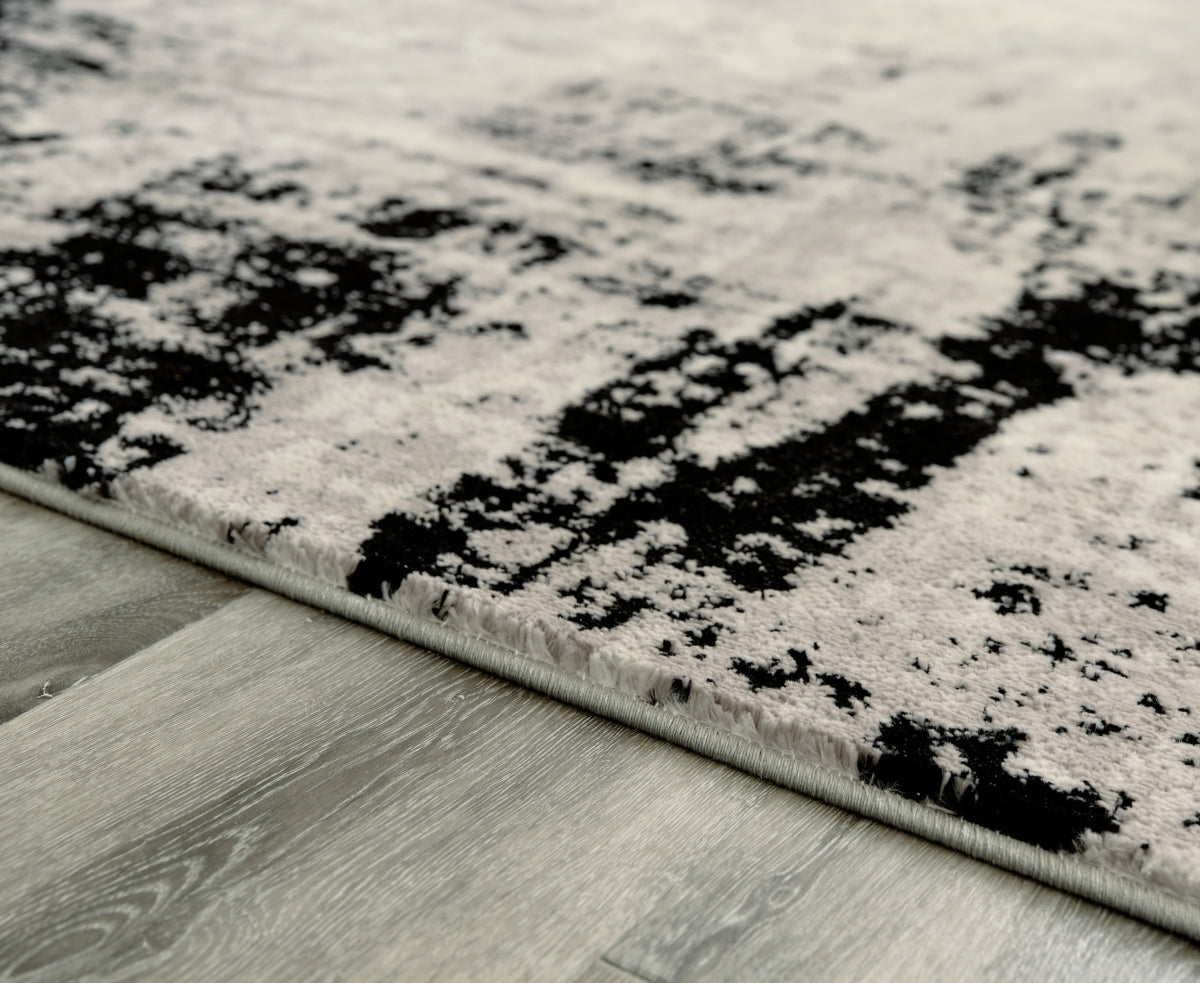 Zekeman 7'10" x 10' Rug - furniture place usa