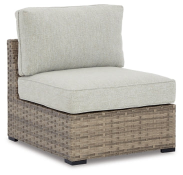 Calworth Outdoor 9-Piece Sectional with Ottoman - furniture place usa