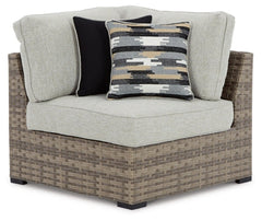 Calworth Outdoor 9-Piece Sectional with Ottoman - furniture place usa